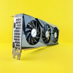 a close up of a computer fan on a yellow background