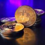 a pile of bitcoins sitting on top of a table