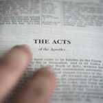 a close up of a person reading a book