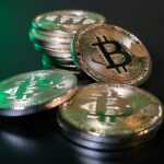 a pile of bitcoins sitting on top of a table